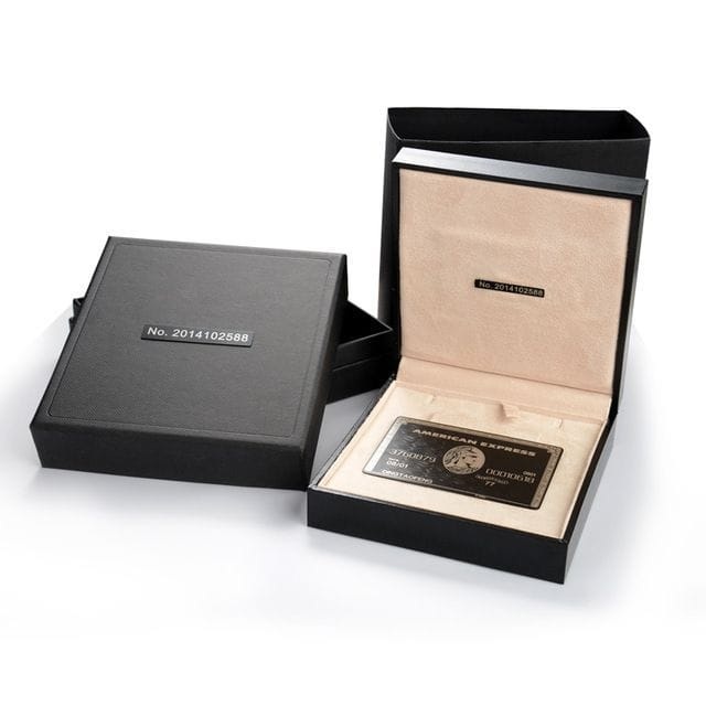 Luxury gift box with leather accessory and keychain wrapped in a ribbon